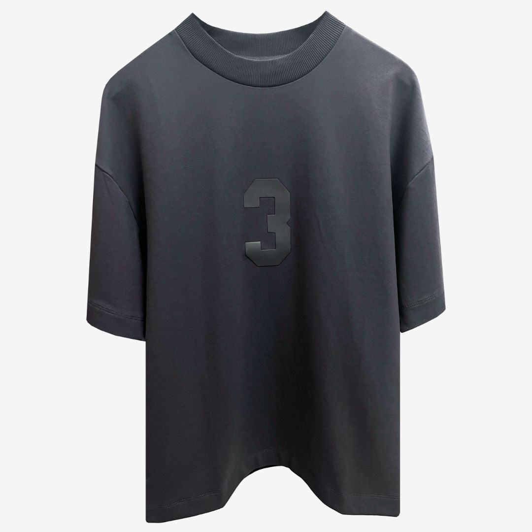 A grey oversized t-shirt featuring the number 3, showcasing luxury street style from the Indian brand Beyond Extremes.