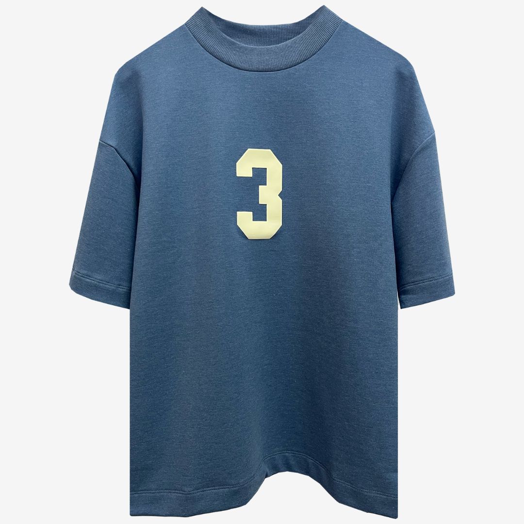 A blue oversized t-shirt featuring the number 3, showcasing luxury street style from the Indian brand Beyond Extremes.