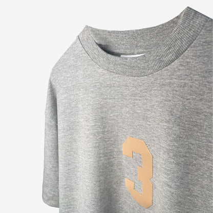 Oversized grey t-shirt with the number 3, representing luxury streetwear from the Indian brand Beyond Extremes.